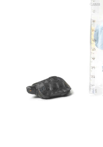 By Seiyodo Tomiharu (1733-1810), Iwami Province, 1796-7 An ebony netsuke of a tortoise