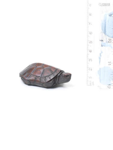 Iwami Province, late 18th/early 19th century A kurogaki (black persimmon) wood netsuke of a tortoise