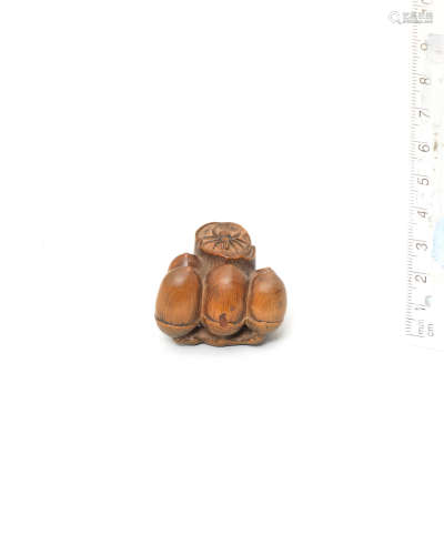 By Mitani Goho, Aki Province, late 18th/early 19th century A boxwood netsuke of a spider on an oak branch