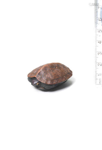 By Takugyoku, Iwami Province, 19th century A boxwood and ebony netsuke of a tortoise