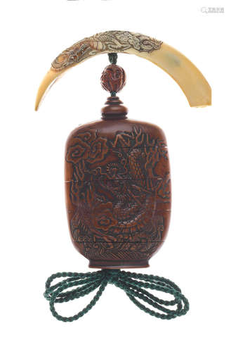 The inro and netsuke by Garyu, 19th century; the ojime by Goseki, 19th century A wood four-case inro, boar-tusk netsuke and wood ojime