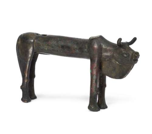 An Elamite bronze zebu bull, circa 3rd millennium B.C., 12.5cm diam. x 7cm. high Provenance: