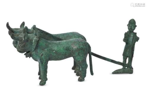 A bronze model of a farmer ploughing with bulls, Anatolia, 2nd millennium B.C, 21.5cm. long