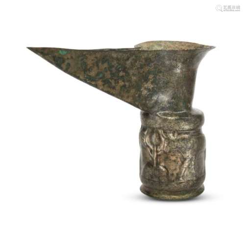 An Amlash spouted high tin bronze ritual vessel with bulls in relief, 1st millennium B.C., of