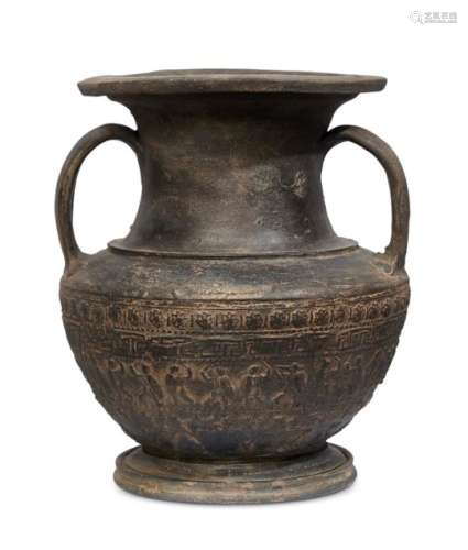 An Etruscan Bucchero amphora, circa 6th century B.C., on a short spreading foot with curved handle