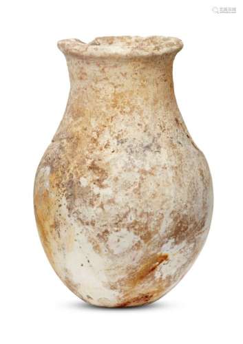 A Bactrian alabaster vessel, 3rd millennium B.C., on a narrow foot rising to a pear-shaped body
