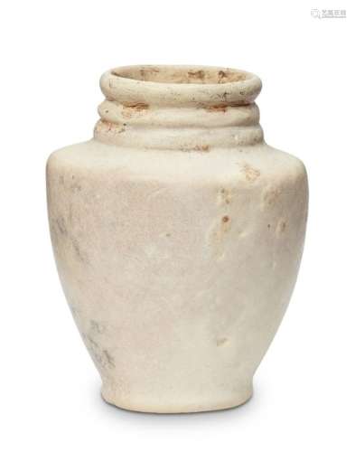 A Bactrian marble vase, 3rd millenium B.C., with foot ring, high shoulder, three rings to neck, 7.
