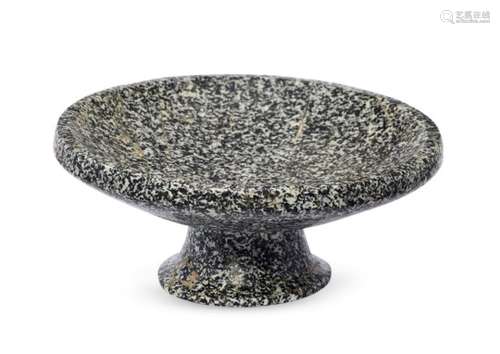 An Achaemenid granite footed bowl, circa 5th century B.C., the thick tapering foot splayed at the