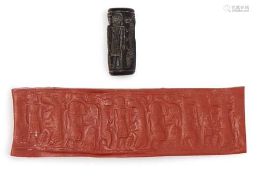 A back steatite cylinder seal with cows, circa 2500 BC, 3.2cm highPlease refer to department for