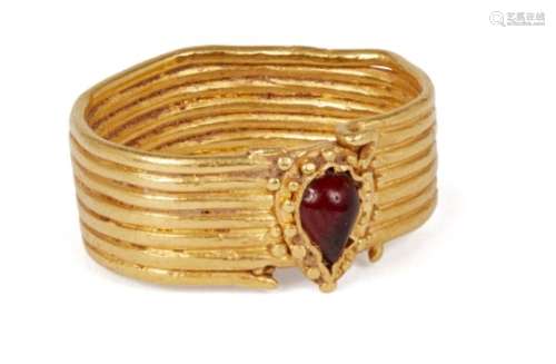 An ancient gold ring with pear-shaped red glass stone, 6th-4th century BC., ring size M approx.,