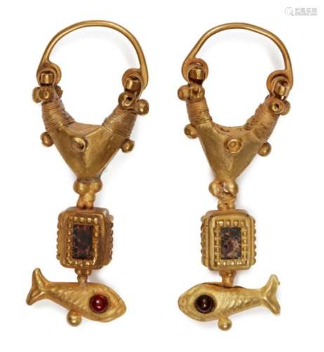 A pair of garnet-set gold earrings with fish, 2nd century B.C. -1st century A.D., the suspension