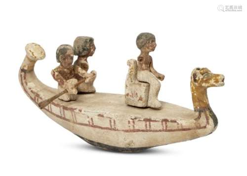 An Egyptian gesso-painted wood funerary model of a boat, Middle Kingdom, circa 2046-1794 B.C., the