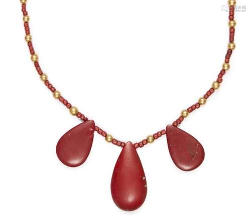 An Egyptian gold and red glass three tear necklace, New Kingdom, 14th century B.C., on a string of