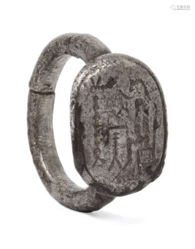 A Hellenistic silver ring with engraved seated figure, 2nd century B.C. - 1st century A.D., 1.8cm.