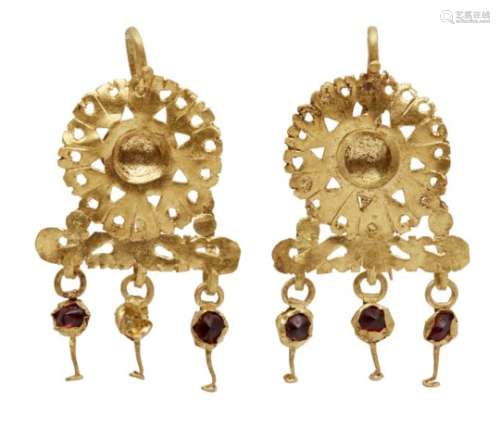 A pair of Etruscan gold sheet earrings, the pendant in the form of a flowerhead with openwork edges,