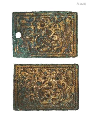 A pair of gilded bronze plaques, 3rd-1st century B.C., each cast in low relief with a camel shown in