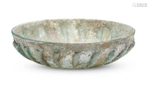 A large Roman bluish-green cast pillar-moulded ribbed glass bowl, 1st centuryA.D., the shallow