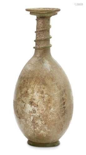 A late Roman light green glass flask, Eastern Mediterranean, 3rd-4th century AD, the flaring