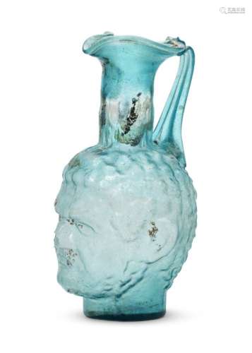 A very large Roman-style mould-blown blue glass head vase, 20th century or earlier, the body moulded