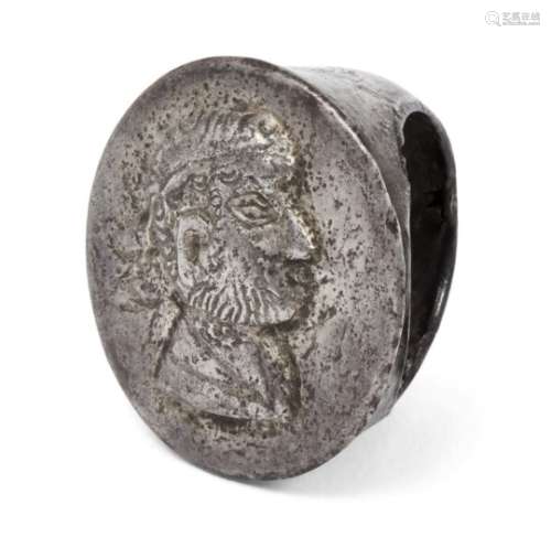 A Roman silver ring with a repousse portrait of a bearded man, 1st to 2nd century A.D., 3cm, diam.