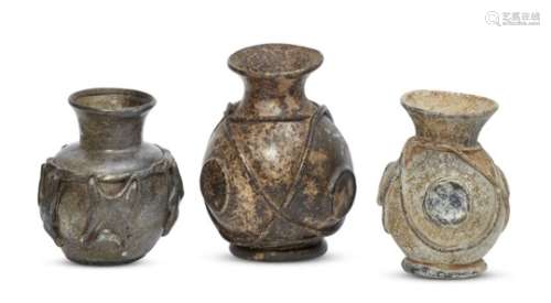 Three post-Roman squat globular form glass jars, Eastern Mediterranean, 6th-7th century, with disc