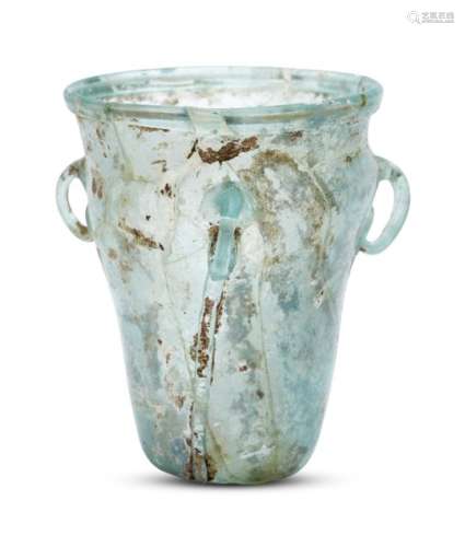 A Byzantine pale bluish-green hanging glass lamp, 6th-7th century, the hollow tubular rim on a