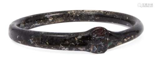 A Byzantine black glass bangle, Eastern Mediterranean, 5th-7th century AD, with a pincered join, 8.