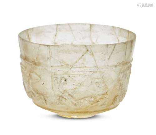 An Islamic relief-cut bowl, Iran, possibly Nishapur, 9th-10th century, made in pale yellow glass