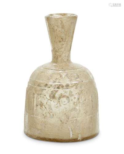 An Islamic yellowish wheel-cut flask, probably Iran, 9th-10th century, the flaring mouth with