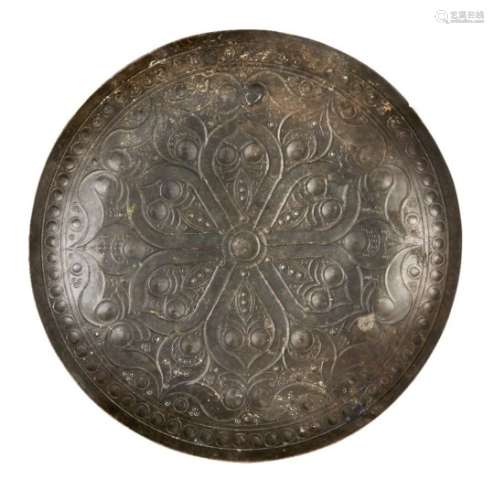 An inscribed Ghaznavid engraved metal dish, Iran, 11th century, of circular form, with six-