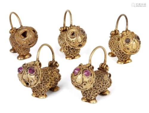 A group of five gold earrings in the form of small lions, Iran, 12th century, some with stone-set