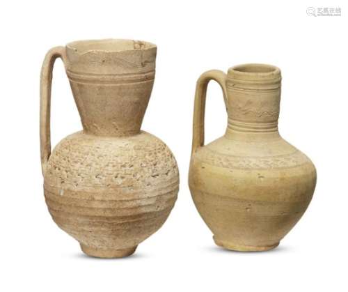 Two unglazed pottery jugs, Iran, 10th century, with globular bodies bearing stamped decorations