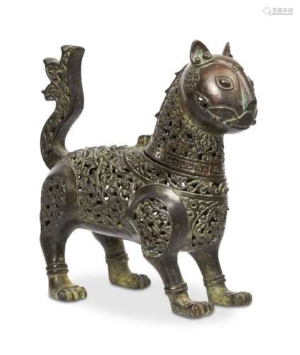 An openwork bronze censer in 12th century style, formed as a standing lion with raised tail,