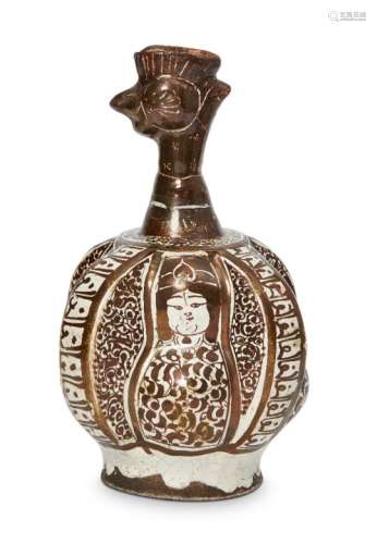 A Kashan moulded lustre pottery cockerel head ewer, Central Iran, 13th century, the lustre-decorated