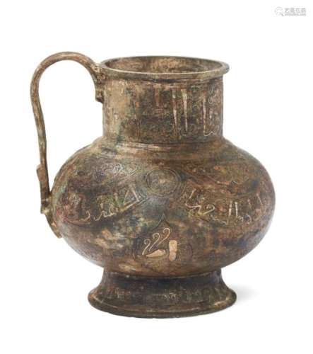 A Khorassan silver and copper inlaid tankard with figures, Northeast Iran, 12th century, rising from