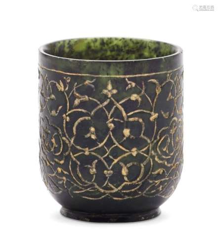 A Timurid-style incised spinach green jade cup with gilded decoration, of cylindrical form, on