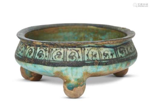 An Ayyubid Raqqa ware underglaze painted pottery bowl, Syria, first half of the 13th century, on