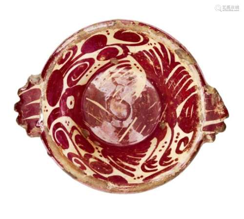 A small Hispano-Moresque copper-lustre scudella, Spain, 15th century, of deep form with applied