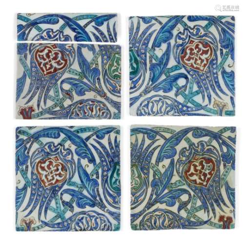 A group of four large Iznik-style tiles and a fragment, 19th-20th century, underglaze painted in