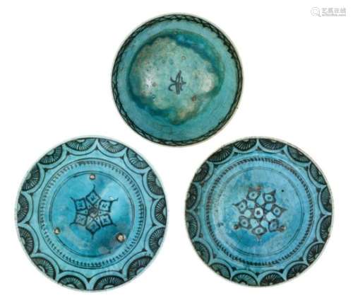 Three Kubachi ware turquoise-glazed pottery dishes, Iran, 18th century, underglaze painted in black,