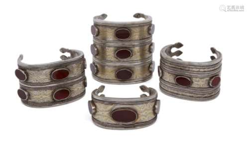 Four Turkman silver parcel gilt bracelets, Tekke, 19th- early 20th century, each with the horizontal