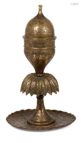 A Qajar engraved brass lidded vessel, Iran, 19th century, the rounded base with lobed rim, rising to
