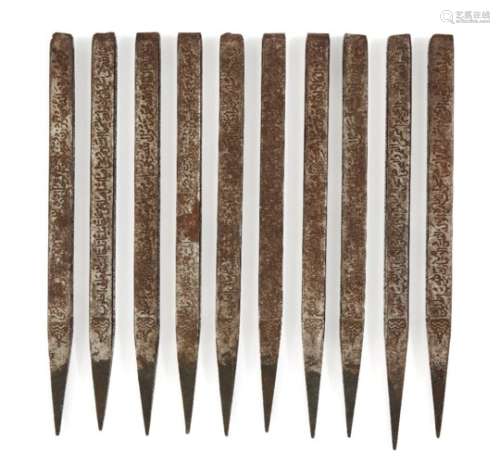 A set of ten Qajar inscribed steel divination rods, Iran, 19th century, each of faceted form,