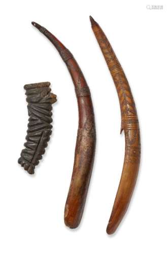 A rhino horn hilt and two African horn grain scoops, 19th century, the hilt deeply carved with lines
