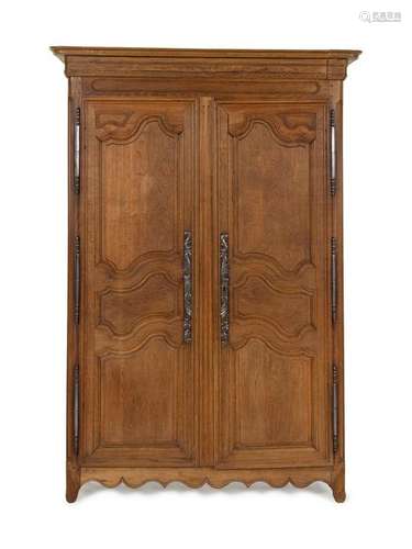 A French Provincial Carved Oak Armoire