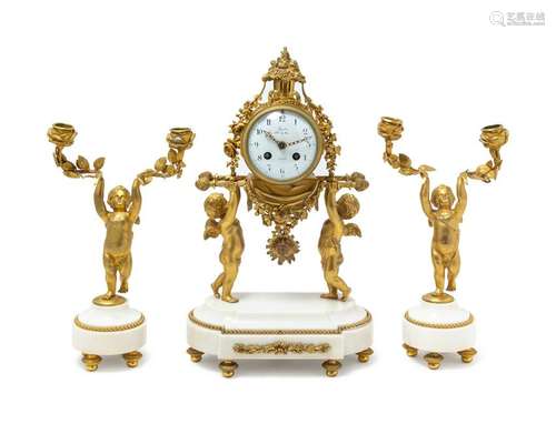 A Louis XVI Gilt Bronze and Marble Three-Piece Clock