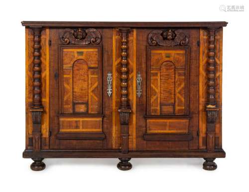 A German Carved Walnut and Marquetry Cabinet