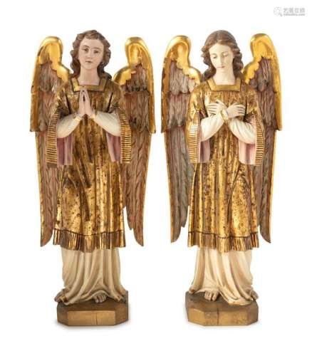 A Pair of Italian Painted and Parcel Gilt Figures of