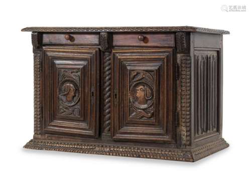 A Continental Carved Oak Cabinet
