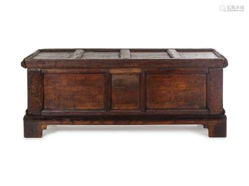 A German Carved and Paneled Walnut Kast